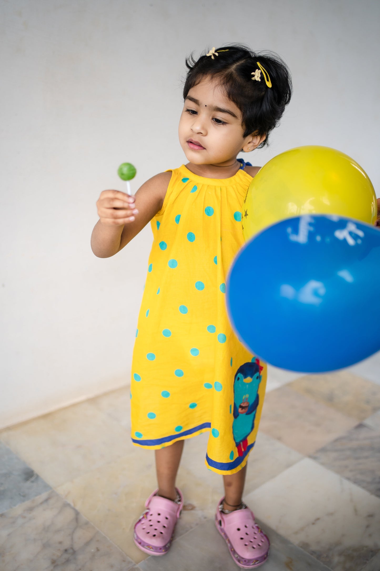 Bhavika Devarapalli Cotton frock, Floral print, Designer cotton frock, birthday theme, kids printed frocks, Best designer kids frock, top Indian Designer kids collection, Best Designer collection, yellow polki dots printed frock, penguin dress, doodles frock.