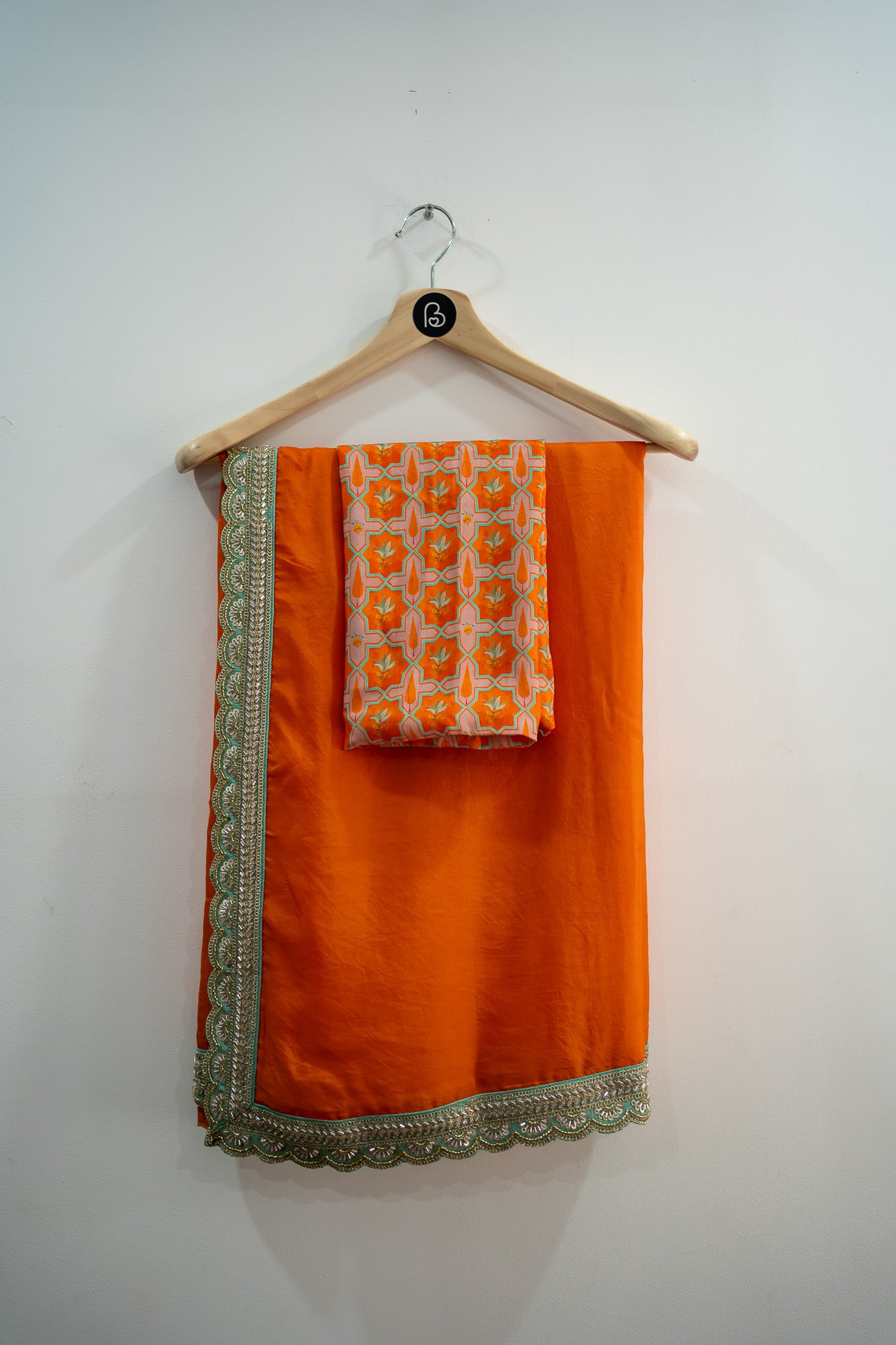 Festival sarees online, Orange designer saree, raw silk blouse, semi silk saree, ethnic wear for women, wedding sarees, festive fashion India, silk sarees with blouse, printed raw silk, designer sarees 2025, saree trends India, Orange silk saree, traditional sarees, party wear sarees, saree with printed blouse, premium sarees online, handcrafted sarees, saree for puja, elegant silk sarees, festive ethnic collection, bhavika devarapalli, vara collection, bhavikadevarapalli brand